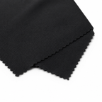 Folded black fabric on a white background