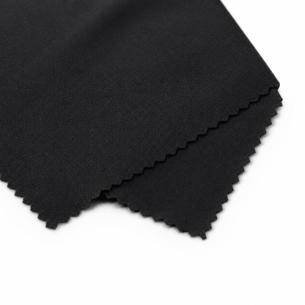Folded black fabric on a white background