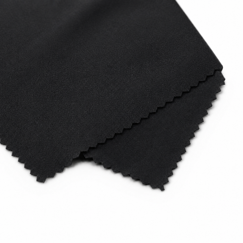 Folded black fabric on a white background